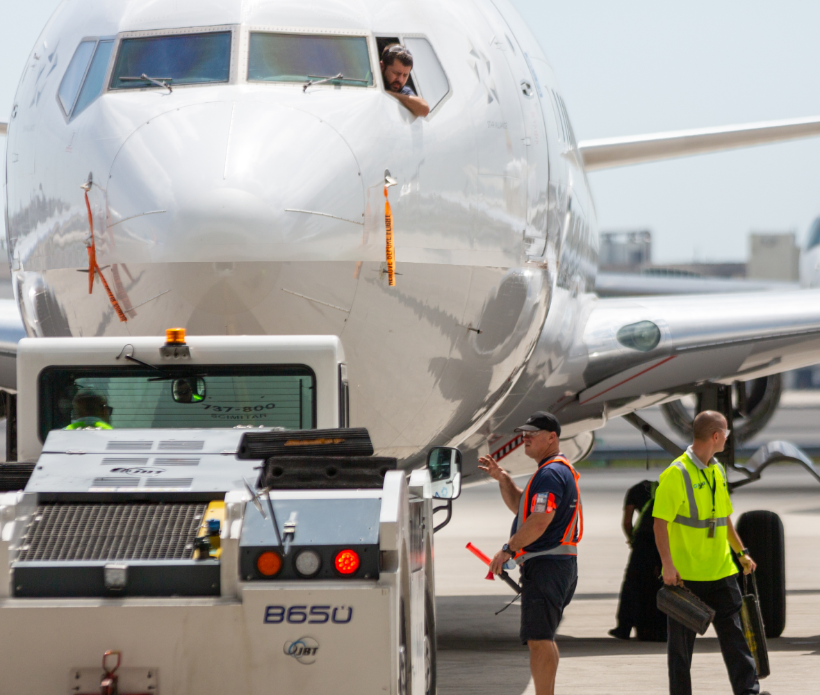 Plane tug into hangar