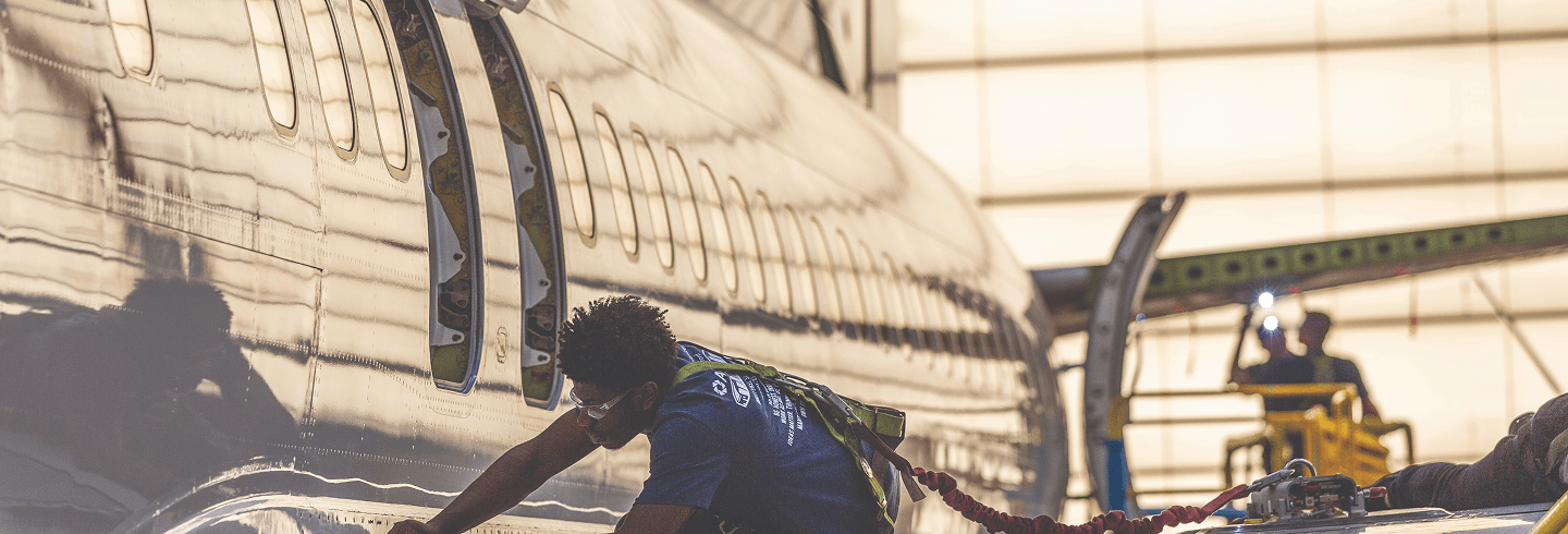 Technician working on an airplane