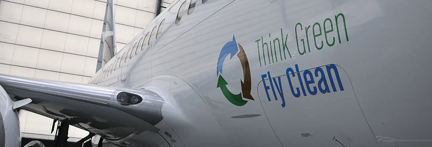 Think green. Fly clean. logo on an airplane