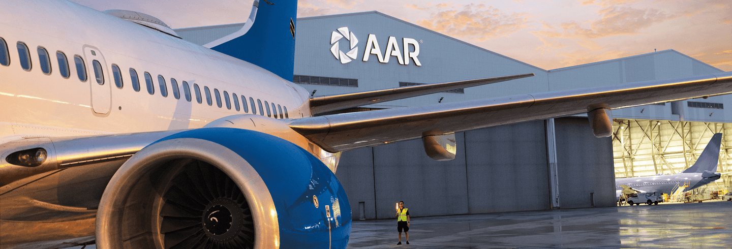 Airplane in front of a hangar